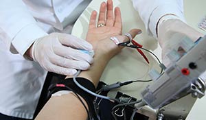 woman taking receiving electromyography (EMG)