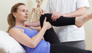 woman stretching after total hip replacement